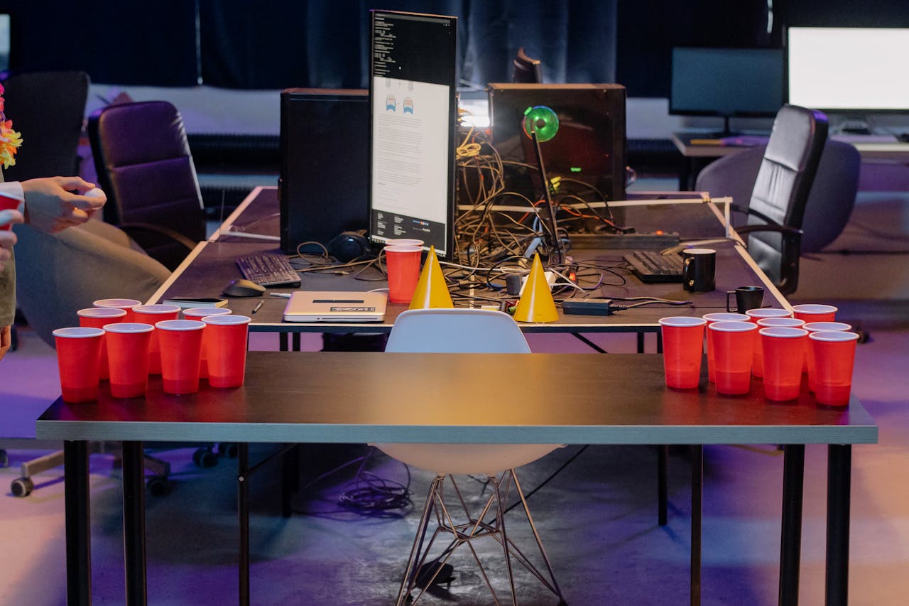 Casual office party setup with beer pong and red cups for a fun atmosphere.